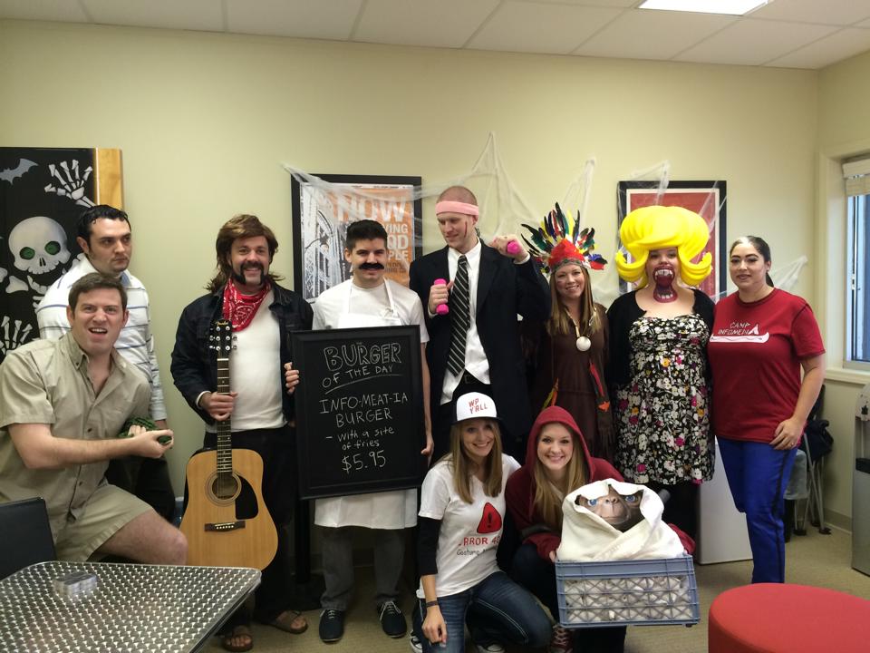 Infomedia employees dressed up for halloween at the office