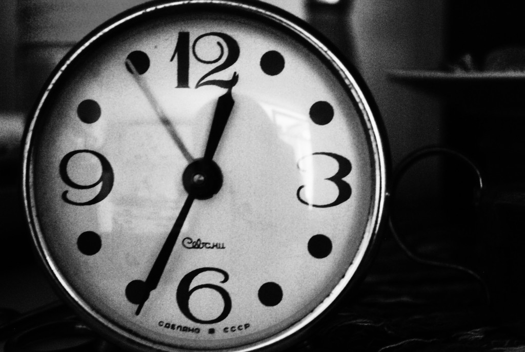 A black and white image of an old clock