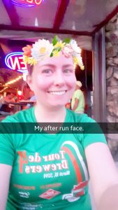 Woman smiles using a Snapchat filter after a run
