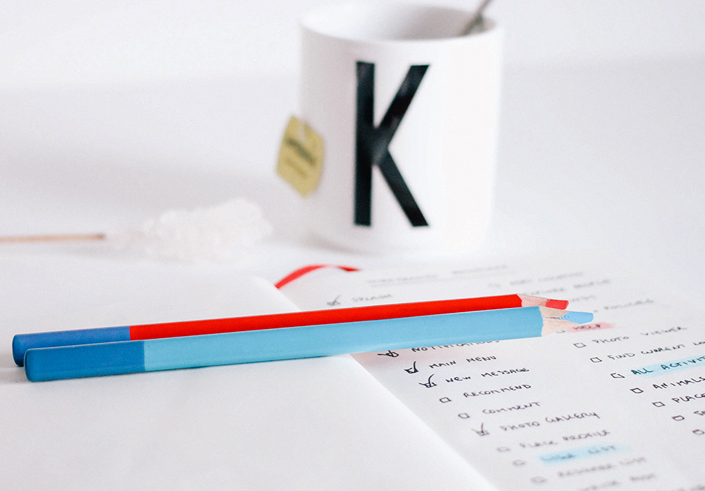web design checklist coffee mug and pencils