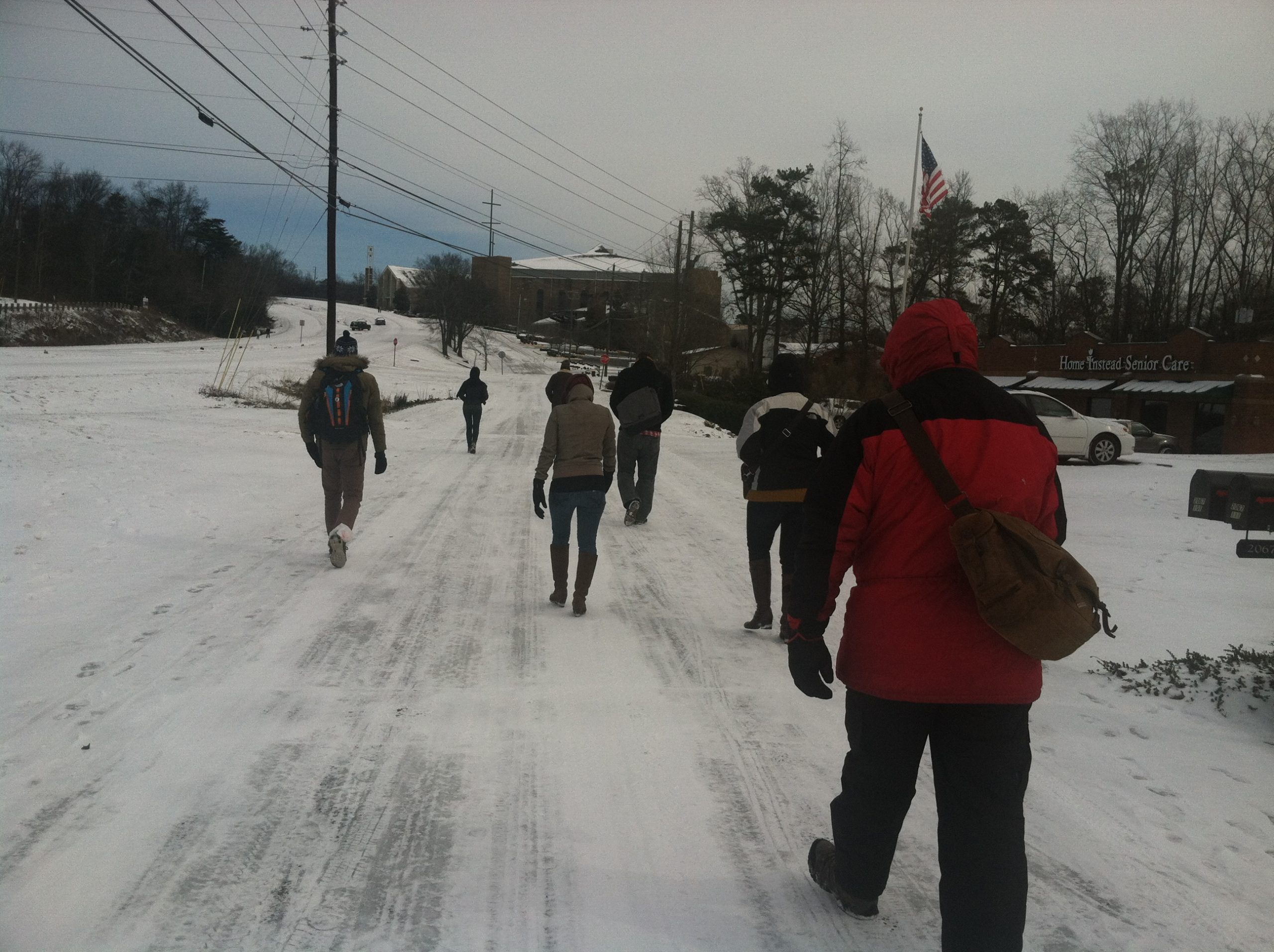 Infomedia employees walking in the snow
