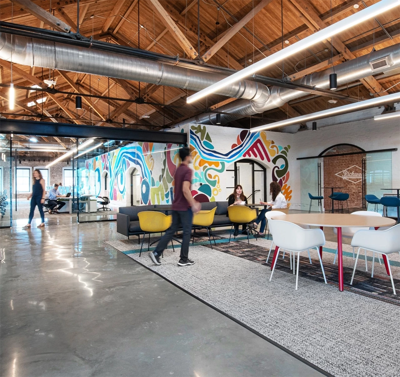 A man walking around the CCR Architecture office