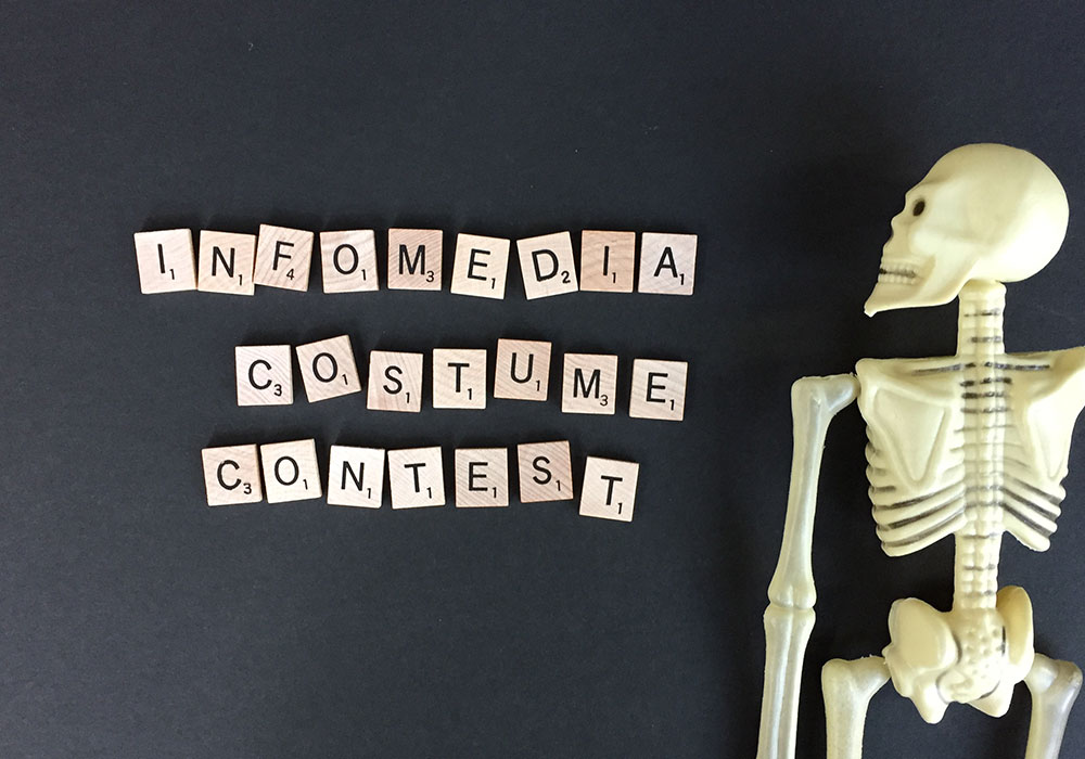 Infomedia Costume Contest with plastic toy skeleton