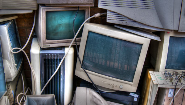 A junkyard of desktop monitors and PCs