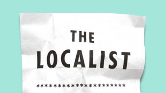 A crumpled up piece of paper with "The Localist" written on it