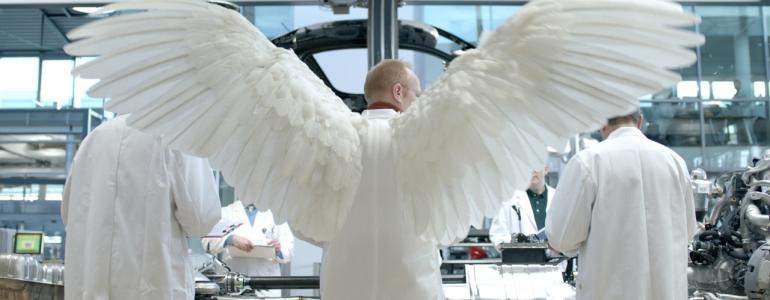 A scientist in a lab with angel wings